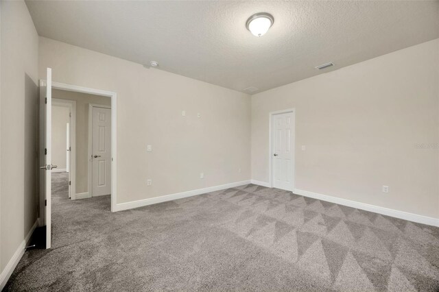 1229 Hillandale Reserve Dr, Tampa, FL 33613 - carpeted spare room with a textured ceiling and baseboards