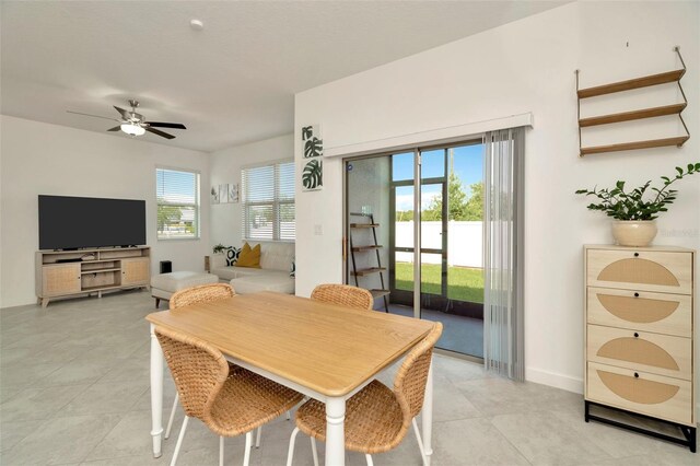3228 Bryant Park Dr, New Port Richey, FL 34655 - dining space with ceiling fan and light tile patterned flooring