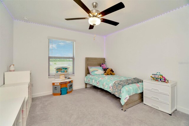 3228 Bryant Park Dr, New Port Richey, FL 34655 - bedroom featuring baseboards, light colored carpet, and a ceiling fan