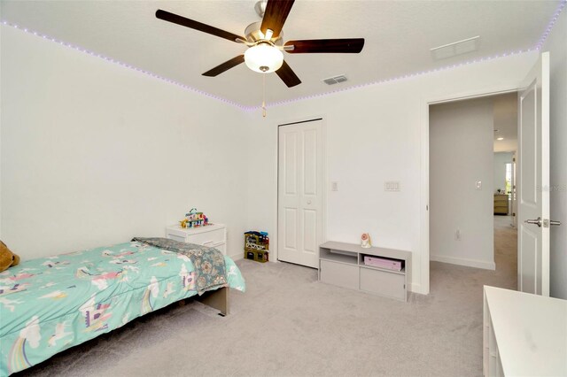 3228 Bryant Park Dr, New Port Richey, FL 34655 - bedroom with light colored carpet, a ceiling fan, and baseboards