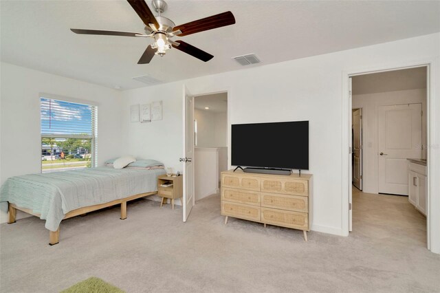 3228 Bryant Park Dr, New Port Richey, FL 34655 - bedroom with light colored carpet and a ceiling fan