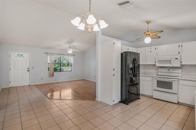 3341 S Jean Pt, Inverness, FL 34450 - kitchen with white appliances, a ceiling fan, vaulted ceiling, light countertops, and a chandelier