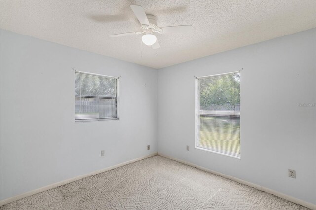 3341 S Jean Pt, Inverness, FL 34450 - carpeted empty room with ceiling fan, a textured ceiling, and baseboards