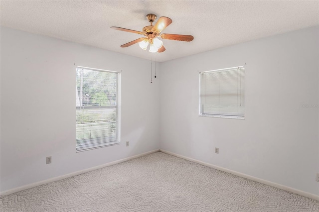 3341 S Jean Pt, Inverness, FL 34450 - unfurnished room with carpet flooring, ceiling fan, baseboards, and a textured ceiling