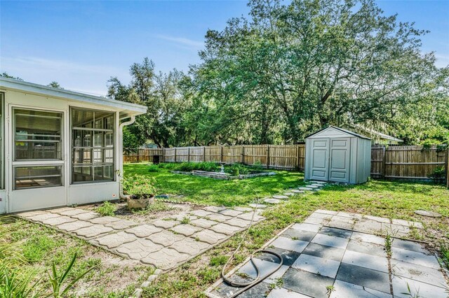 3341 S Jean Pt, Inverness, FL 34450 - view of yard featuring a patio, a vegetable garden, and a sunroom
