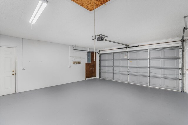 3341 S Jean Pt, Inverness, FL 34450 - garage with a garage door opener and electric panel