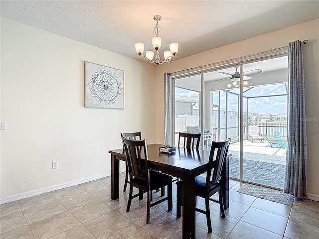 1022 Montgomery Bell Rd, Wesley Chapel, FL 33543 - dining space with baseboards, a chandelier, ceiling fan, light tile patterned floors, and a textured ceiling