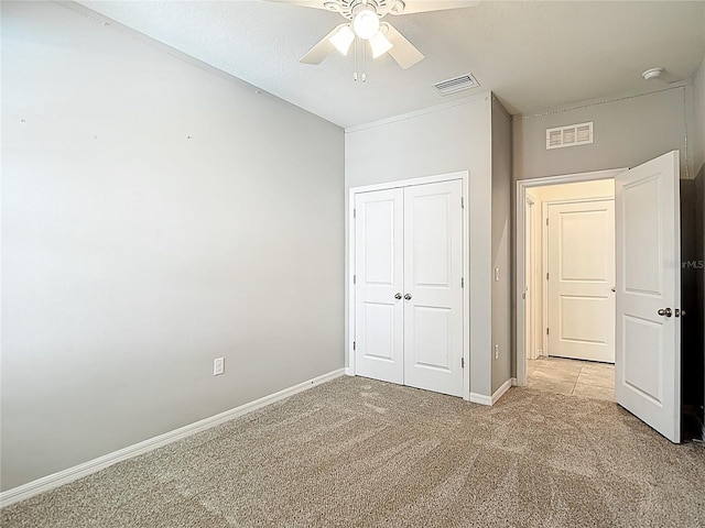 1022 Montgomery Bell Rd, Wesley Chapel, FL 33543 - unfurnished bedroom with light carpet, a closet, and ceiling fan