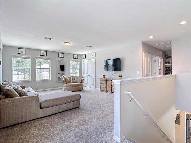1022 Montgomery Bell Rd, Wesley Chapel, FL 33543 - carpeted living room with baseboards, attic access, and recessed lighting