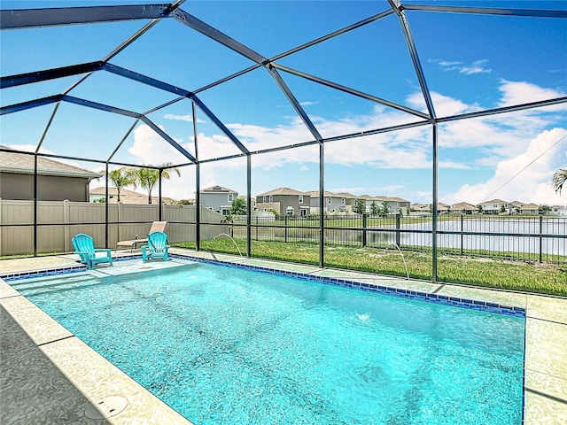 1022 Montgomery Bell Rd, Wesley Chapel, FL 33543 - view of swimming pool featuring a residential view, a water view, a lanai, and a patio