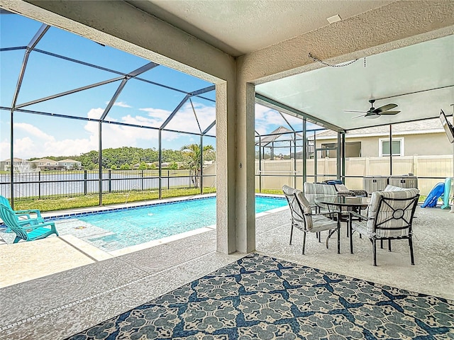 1022 Montgomery Bell Rd, Wesley Chapel, FL 33543 - view of pool featuring a water view, a patio, a fenced backyard, and glass enclosure