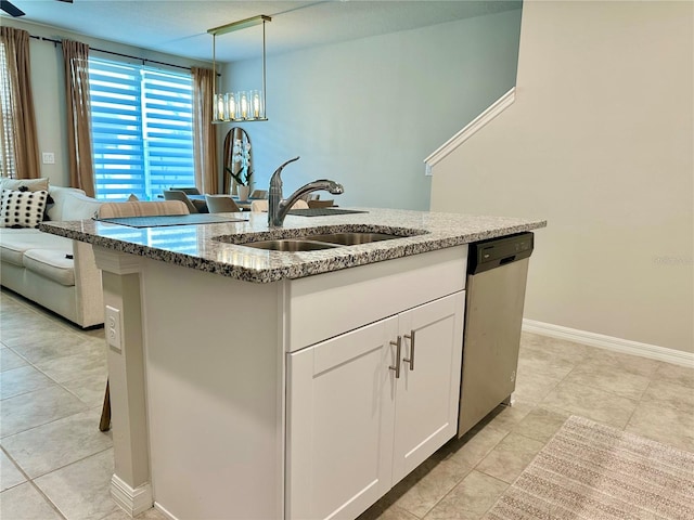 2717 Chestnut Creek Pl, Brandon, FL 33510 - kitchen with dishwasher, a sink, stone countertops, light tile patterned floors, and white cabinets