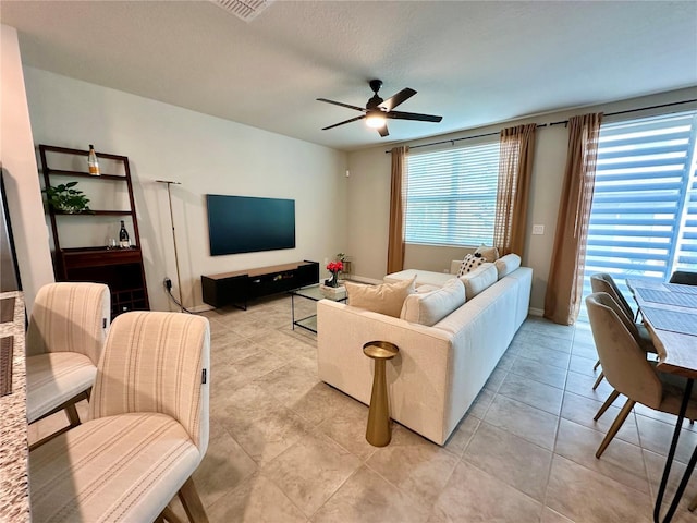 2717 Chestnut Creek Pl, Brandon, FL 33510 - living room featuring ceiling fan and light tile patterned flooring