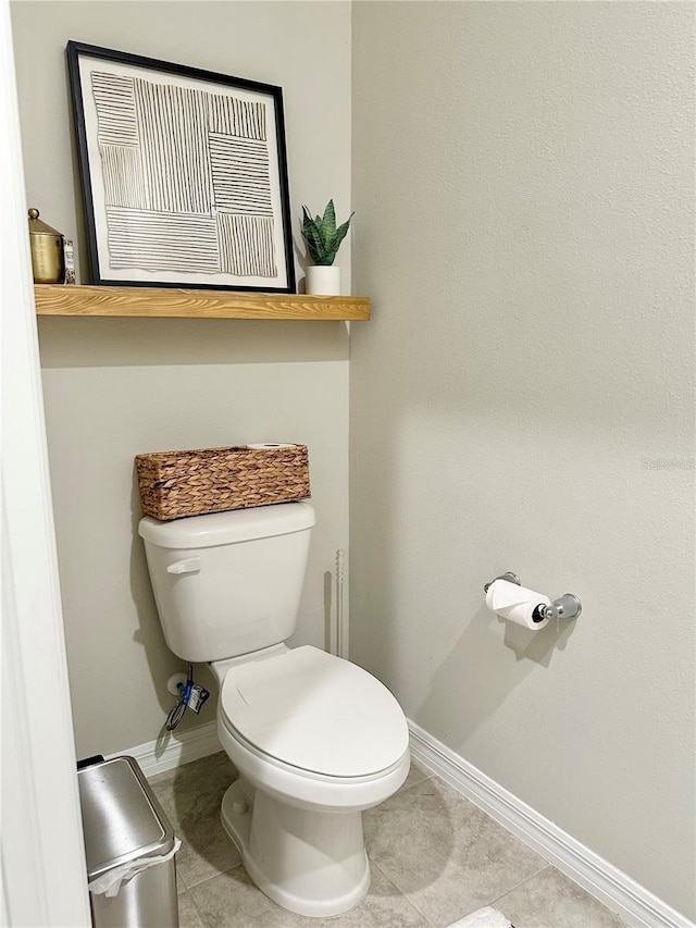 2717 Chestnut Creek Pl, Brandon, FL 33510 - bathroom with baseboards, toilet, and tile patterned floors