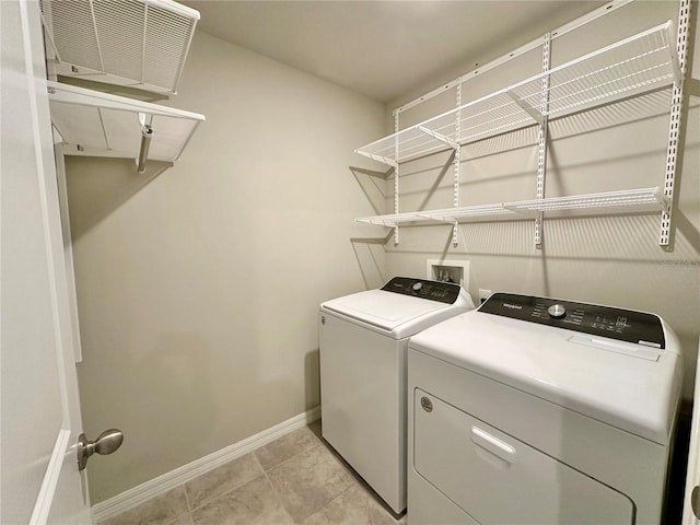 2717 Chestnut Creek Pl, Brandon, FL 33510 - washroom with separate washer and dryer, baseboards, and light tile patterned floors