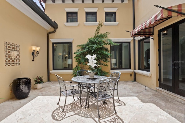 7713 Still Lakes Dr, Odessa, FL 33556 - view of patio featuring outdoor dining space and french doors