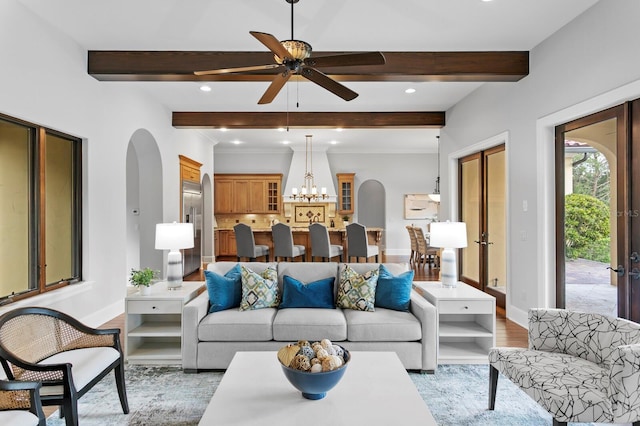 7713 Still Lakes Dr, Odessa, FL 33556 - living room featuring arched walkways, beam ceiling, baseboards, ceiling fan, and recessed lighting