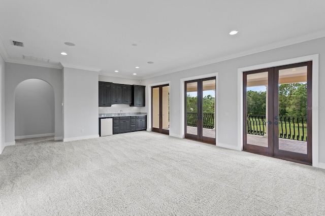 7713 Still Lakes Dr, Odessa, FL 33556 - unfurnished living room with french doors, crown molding, baseboards, healthy amount of natural light, and recessed lighting