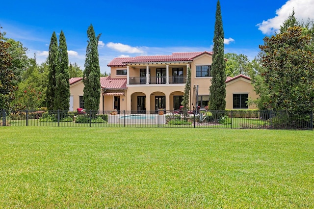 7713 Still Lakes Dr, Odessa, FL 33556 - rear view of property with a tile roof, stucco siding, and a balcony
