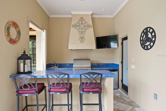 7713 Still Lakes Dr, Odessa, FL 33556 - kitchen with tile counters, a kitchen breakfast bar, crown molding, a sink, and stainless steel dishwasher