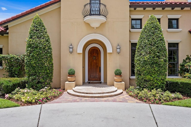 7713 Still Lakes Dr, Odessa, FL 33556 - property entrance featuring a tile roof and stucco siding