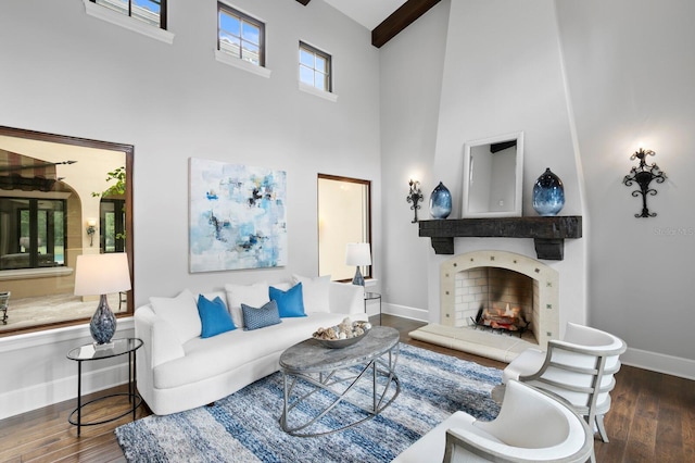 7713 Still Lakes Dr, Odessa, FL 33556 - living room with a high ceiling, wood finished floors, baseboards, and a lit fireplace