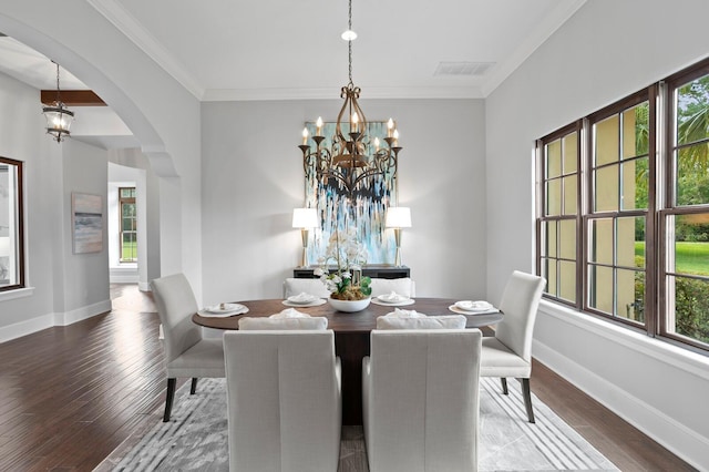 7713 Still Lakes Dr, Odessa, FL 33556 - dining space with a chandelier, arched walkways, plenty of natural light, wood finished floors, and ornamental molding