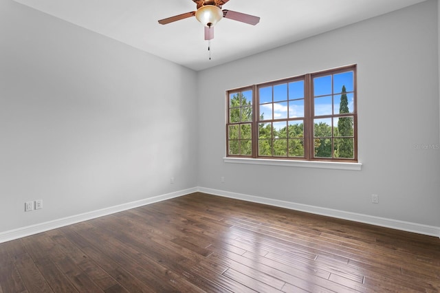 7713 Still Lakes Dr, Odessa, FL 33556 - spare room with a ceiling fan, baseboards, and dark wood finished floors