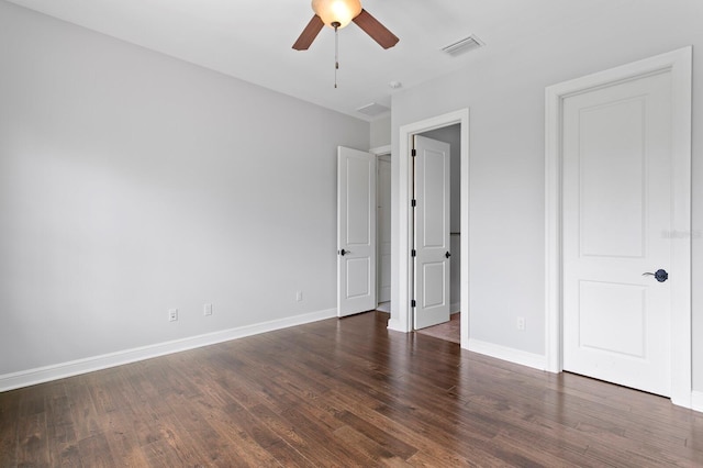 7713 Still Lakes Dr, Odessa, FL 33556 - unfurnished bedroom with wood finished floors, baseboards, and ceiling fan