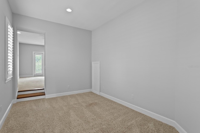 7713 Still Lakes Dr, Odessa, FL 33556 - unfurnished room featuring baseboards, recessed lighting, and carpet