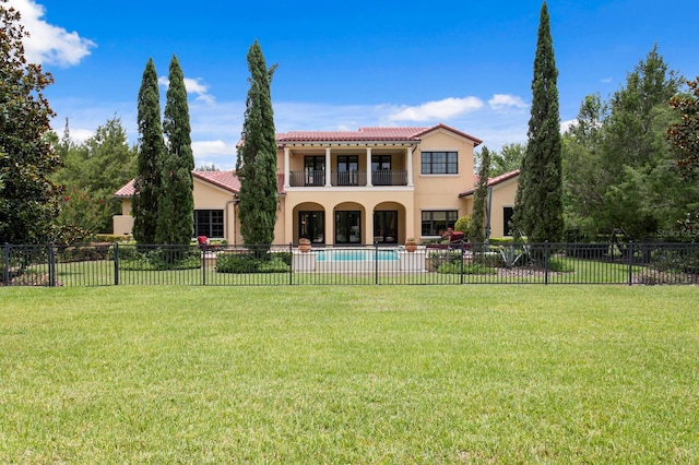 7713 Still Lakes Dr, Odessa, FL 33556 - back of house with a balcony, stucco siding, a tiled roof, and a patio area