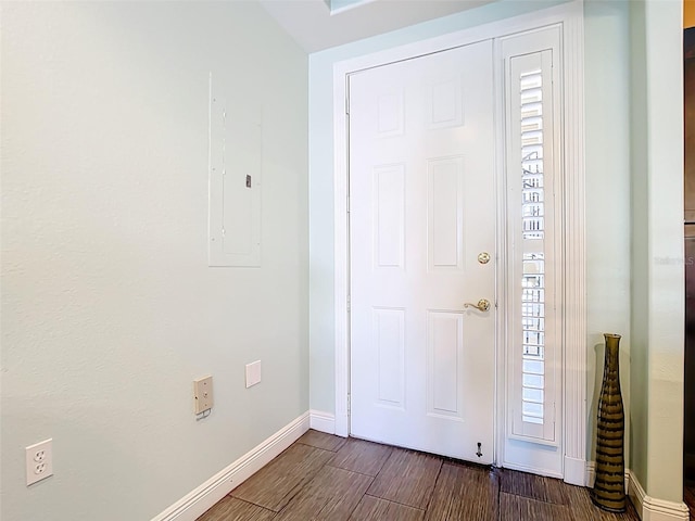3334 Purple Martin Dr Unit 212, Punta Gorda, FL 33950 - foyer featuring electric panel, baseboards, and dark wood finished floors