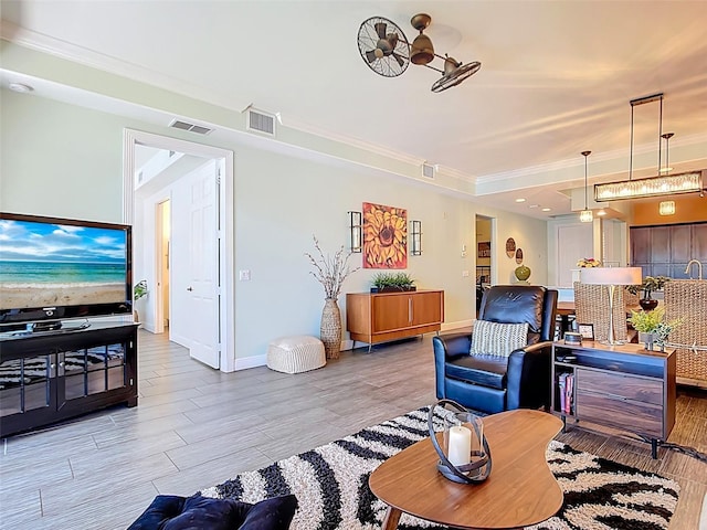 3334 Purple Martin Dr Unit 212, Punta Gorda, FL 33950 - living area featuring ornamental molding, light wood-style flooring, and baseboards