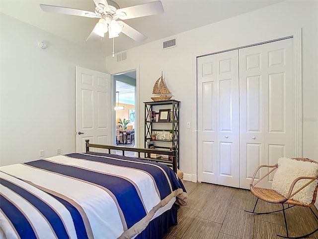 3334 Purple Martin Dr Unit 212, Punta Gorda, FL 33950 - bedroom featuring a closet, a ceiling fan, baseboards, and wood finished floors