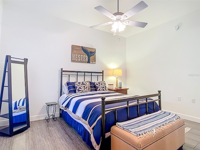 3334 Purple Martin Dr Unit 212, Punta Gorda, FL 33950 - bedroom featuring baseboards, wood finished floors, and ceiling fan