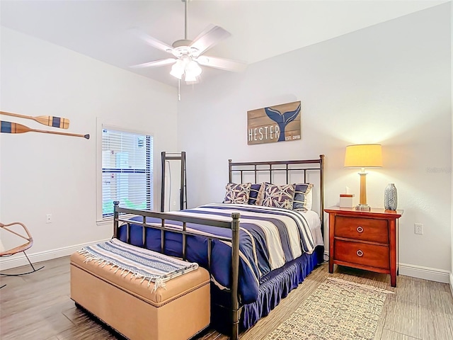 3334 Purple Martin Dr Unit 212, Punta Gorda, FL 33950 - bedroom featuring baseboards, wood finished floors, and a ceiling fan