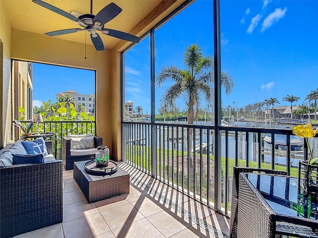 3334 Purple Martin Dr Unit 212, Punta Gorda, FL 33950 - sunroom with a ceiling fan, a water view, and outdoor lounge area