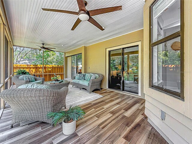 66 Bay Woods Dr, Safety Harbor, FL 34695 - sunroom / solarium with a ceiling fan and an outdoor hangout area
