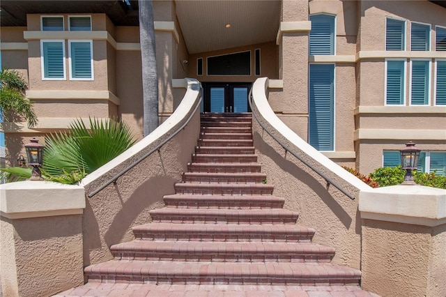514 Harbor Dr N, Indian Rocks Beach, FL 33785 - entrance to property with stucco siding and french doors