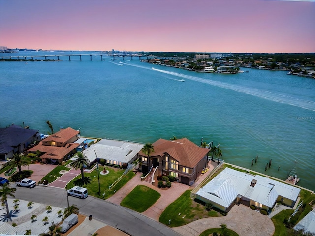 514 Harbor Dr N, Indian Rocks Beach, FL 33785 - aerial view at dusk of a notable bridge and a water view