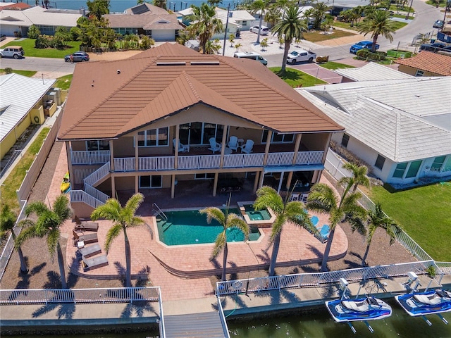 514 Harbor Dr N, Indian Rocks Beach, FL 33785 - back of house featuring a patio area, a fenced backyard, and a tiled roof