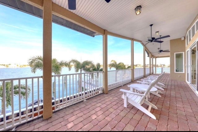 514 Harbor Dr N, Indian Rocks Beach, FL 33785 - view of patio / terrace featuring a ceiling fan, a water view, and a balcony