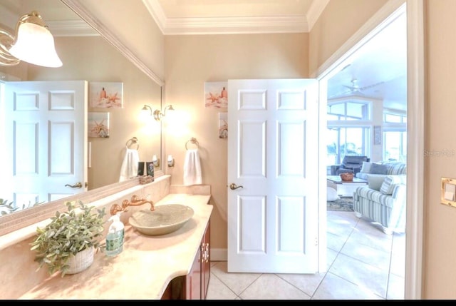 514 Harbor Dr N, Indian Rocks Beach, FL 33785 - bathroom featuring ornamental molding, tile patterned flooring, and vanity
