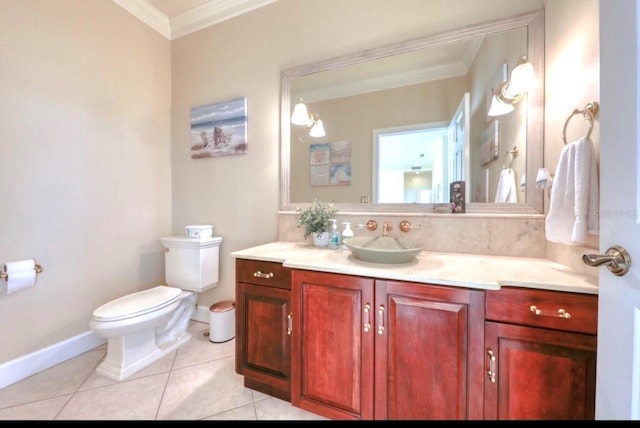 514 Harbor Dr N, Indian Rocks Beach, FL 33785 - bathroom featuring ornamental molding, vanity, toilet, baseboards, and tile patterned floors