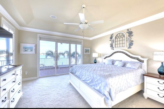 514 Harbor Dr N, Indian Rocks Beach, FL 33785 - carpeted bedroom with a tray ceiling, access to outside, a ceiling fan, and baseboards