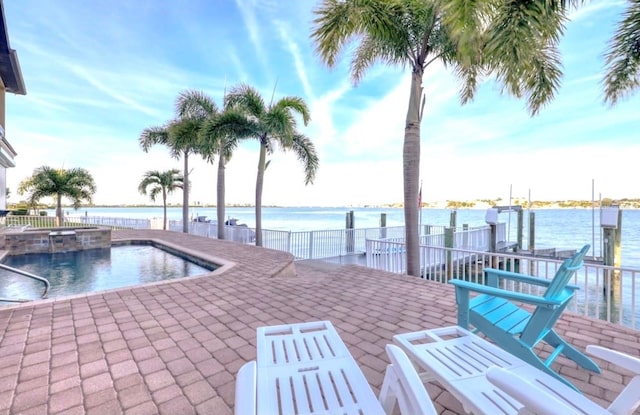 514 Harbor Dr N, Indian Rocks Beach, FL 33785 - community pool with a water view, a community hot tub, and a patio