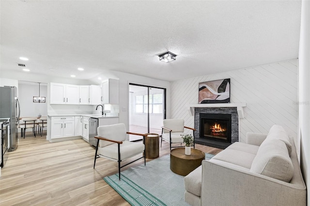 622 Cedar Grove Dr, Brandon, FL 33511 - living area featuring a fireplace, light wood-style floors, recessed lighting, and baseboards