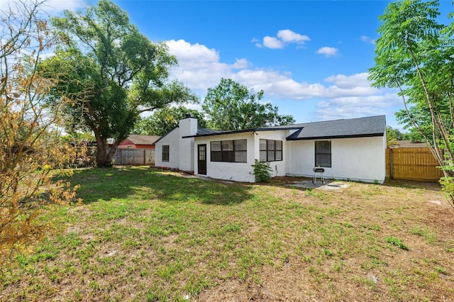 622 Cedar Grove Dr, Brandon, FL 33511 - back of house with a chimney