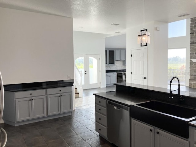 14510 Mj Rd, Myakka City, FL 34251 - kitchen with dishwasher, dark countertops, a sink, wine cooler, and tasteful backsplash