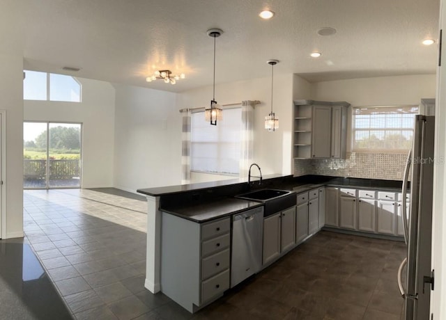 14510 Mj Rd, Myakka City, FL 34251 - kitchen featuring appliances with stainless steel finishes, dark countertops, a sink, open shelves, and open floor plan